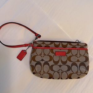 Coach wristlet with Coach ‘C’ insignia, Coach red patent leather tag and trim